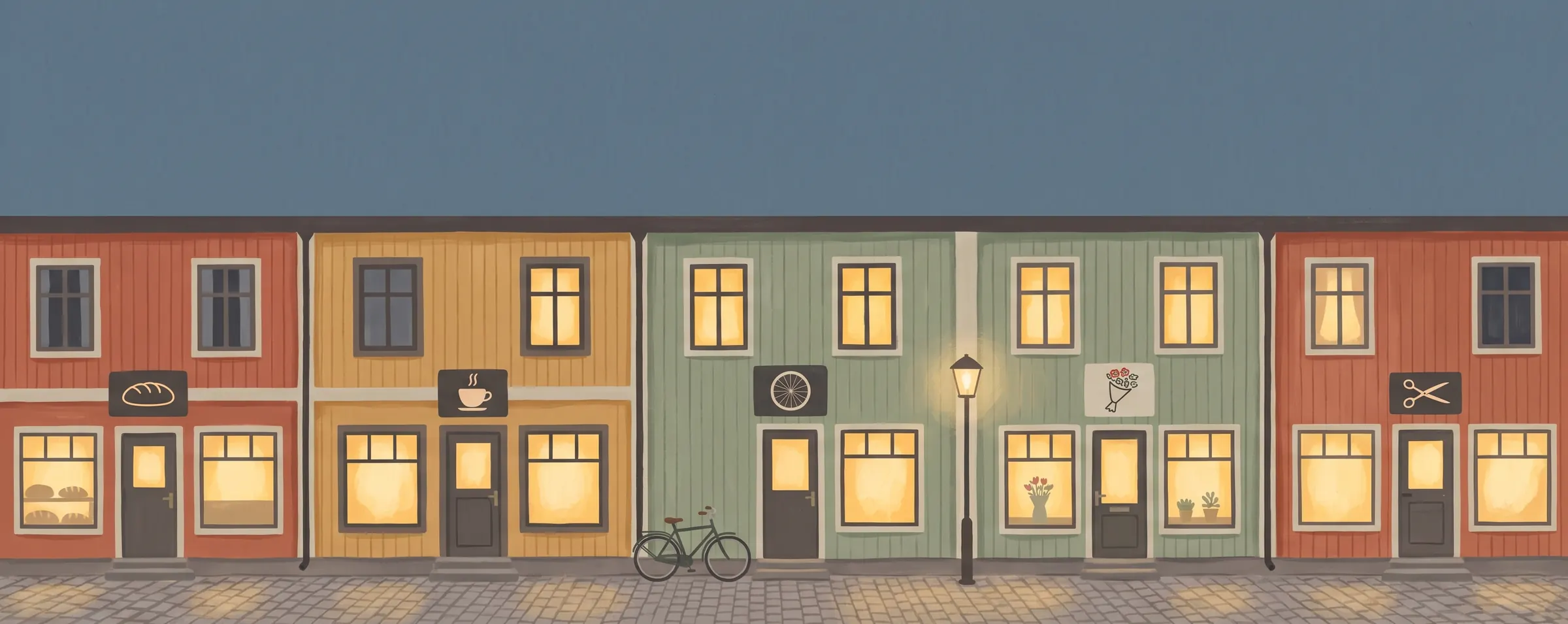 Samma gata en kväll, med varmt ljus i fönstren